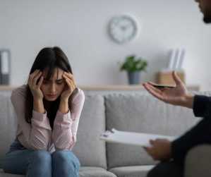 A woman at a counseling meeting to talk about her PTSD.